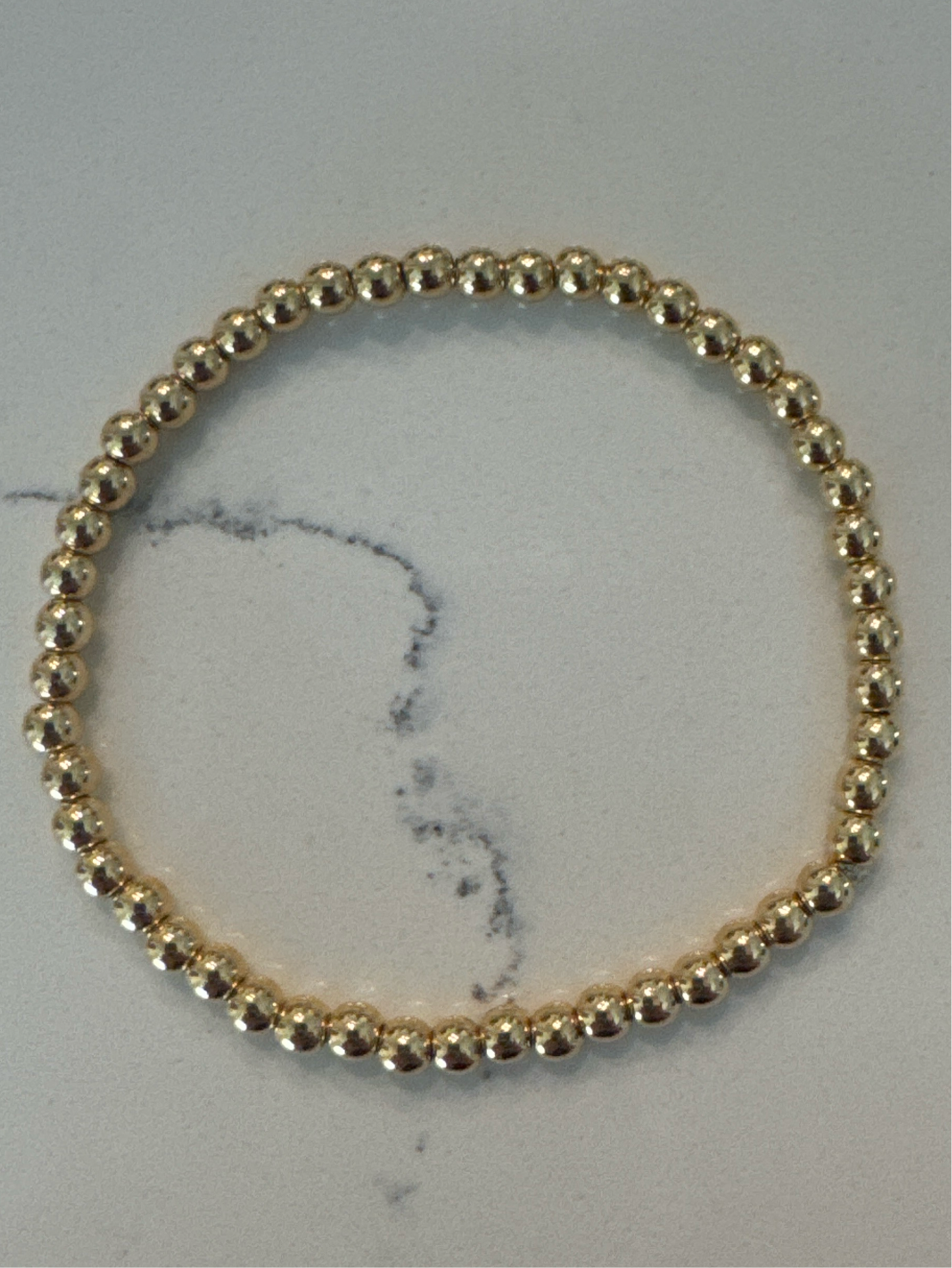 Tiny gold bead bracelet