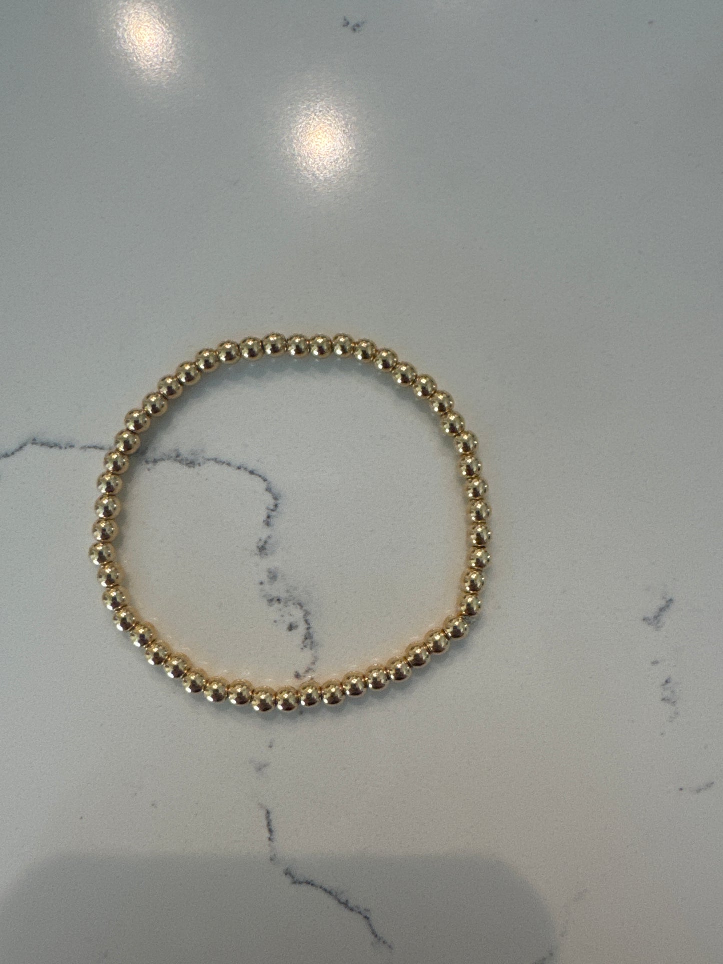 Tiny gold bead bracelet