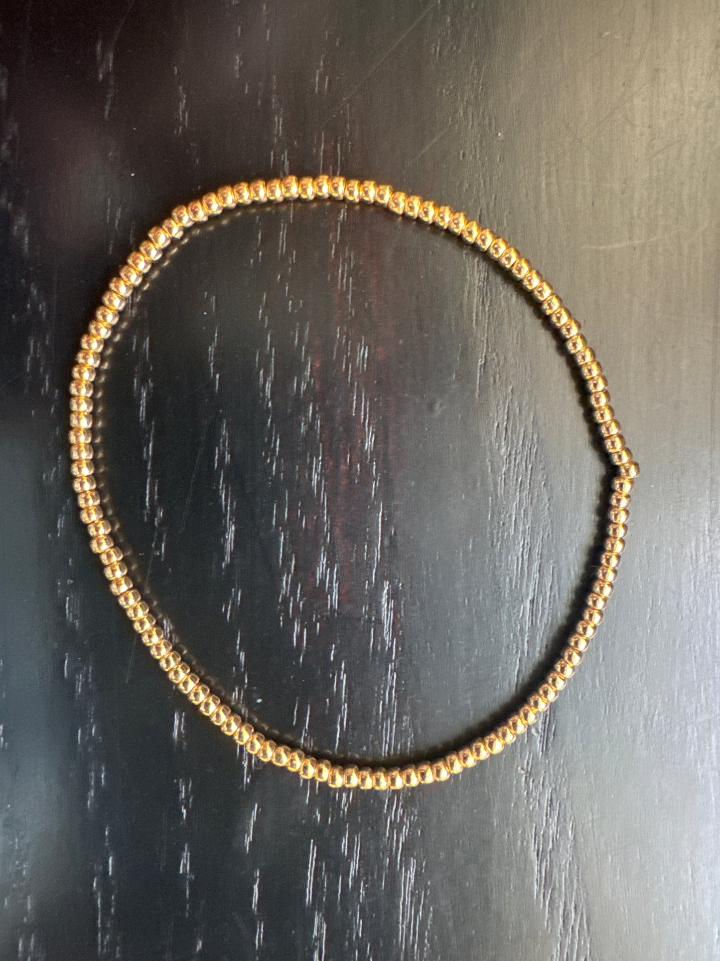 Tiny gold bead bracelet