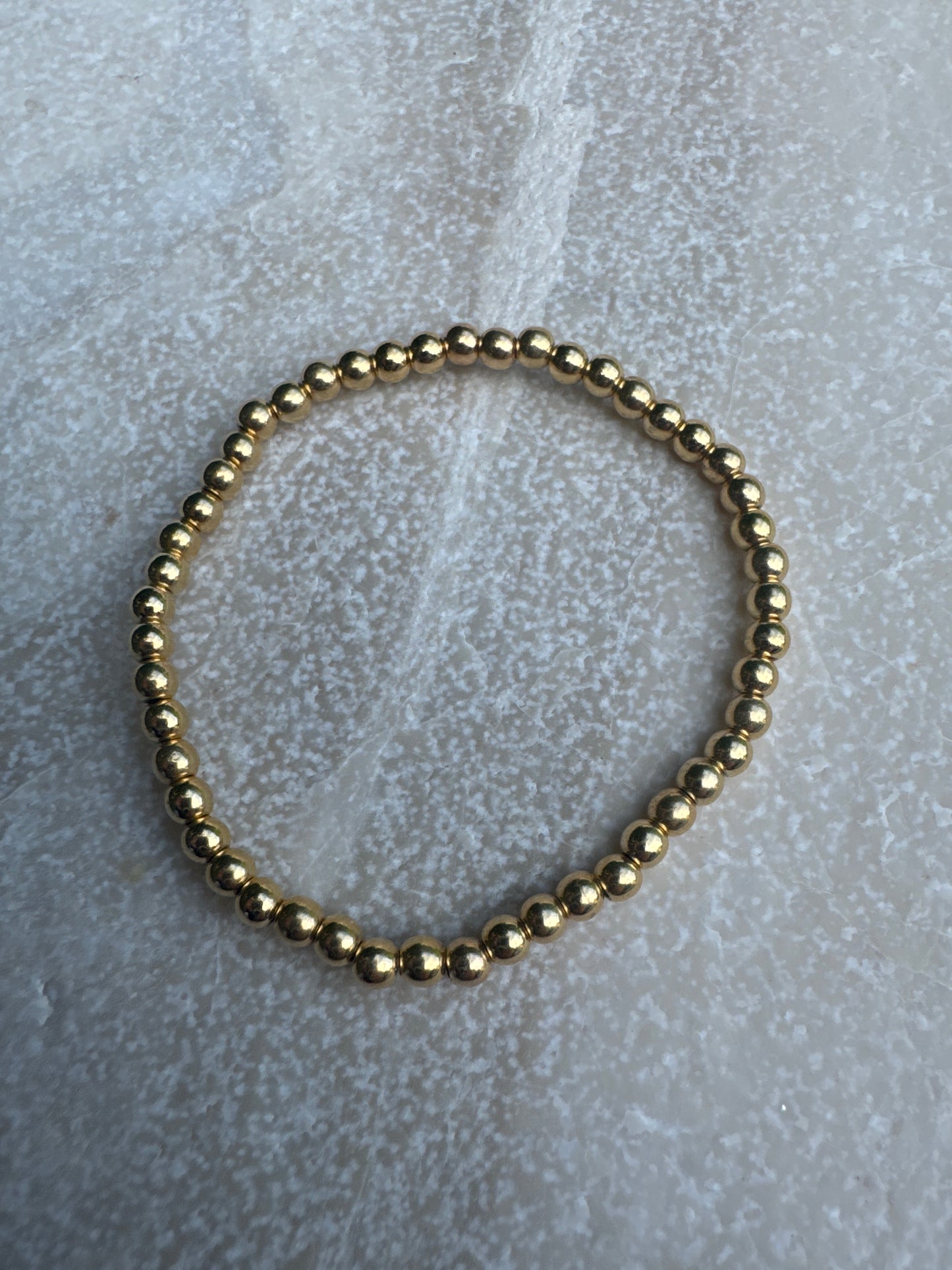 Tiny gold bead bracelet